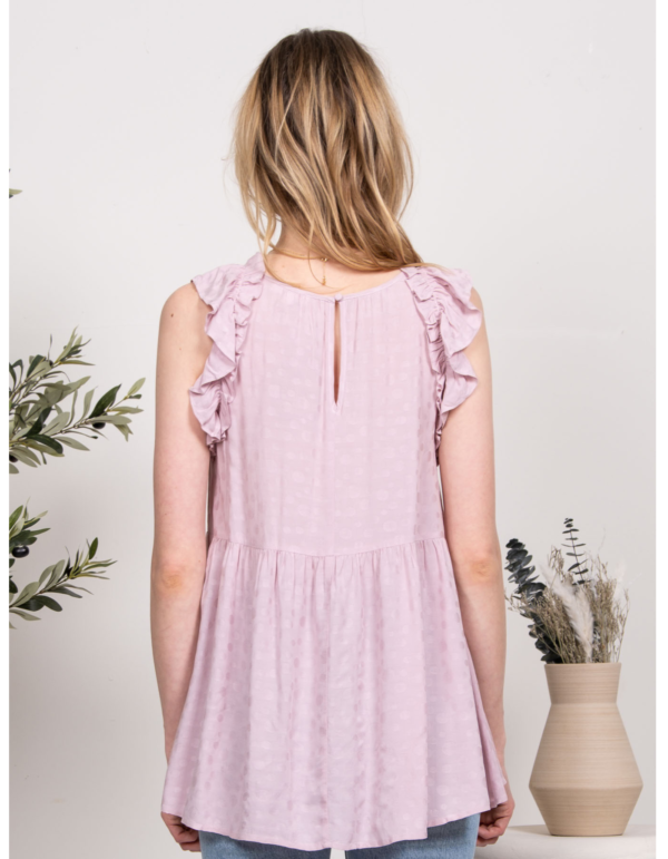 Blusa sin mangas con vuelo y detalles de volantes