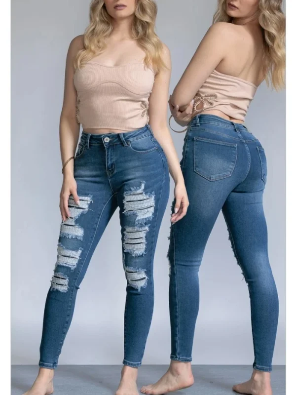 Jeans skinny de mezclilla con acabado desgastado para mujer